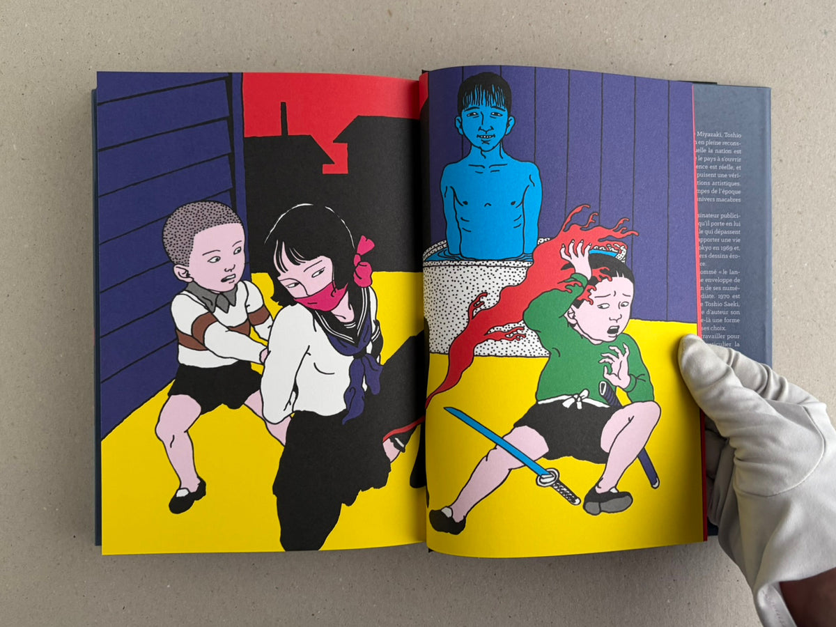 Rêve écarlate by Toshio Saeki open to a yellow-and-black spread with a child and several figures in a courtyard scene.