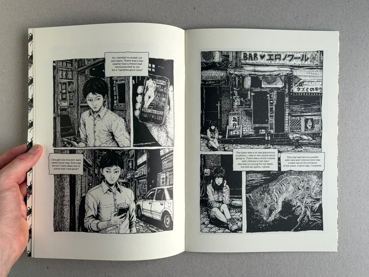 Open comic book spread from Rattling City #1: Something in Skin by Demitri Vassiliadis, showing black-and-white interior pages with manga-style panels and speech captions.