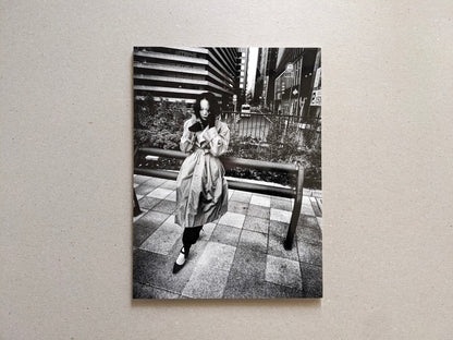 Back cover of Record No. 50 by Daido Moriyama, street photograph of a woman standing in an urban setting.