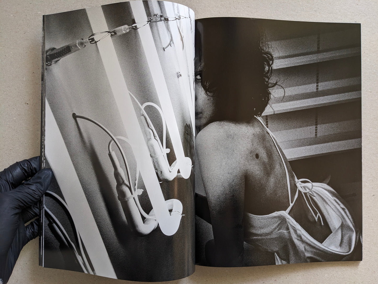 Black-and-white photograph with fluorescent lights and a nude figure seen from behind, Record No. 50 by Daido Moriyama.
