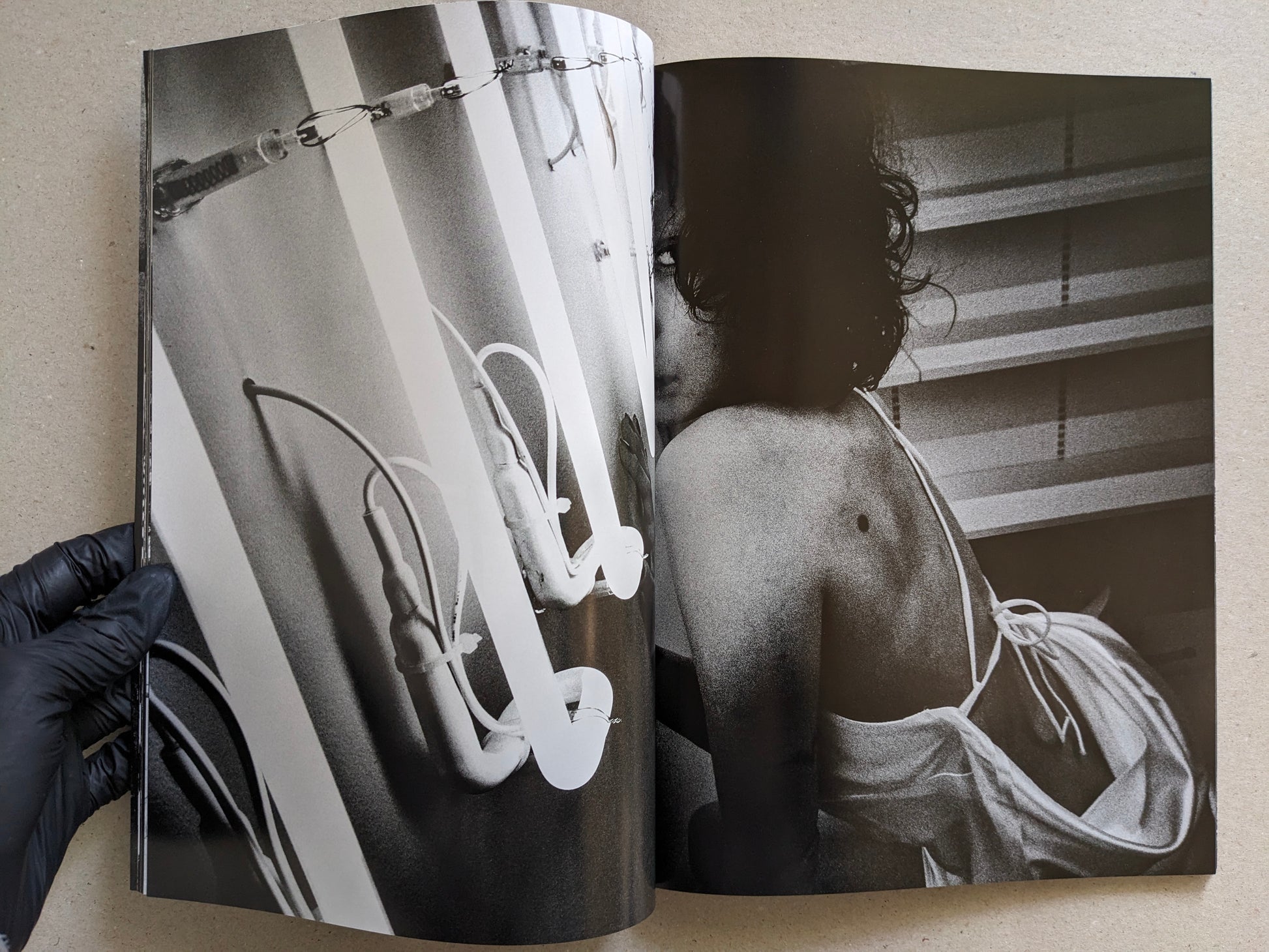 Black-and-white photograph with fluorescent lights and a nude figure seen from behind, Record No. 50 by Daido Moriyama.