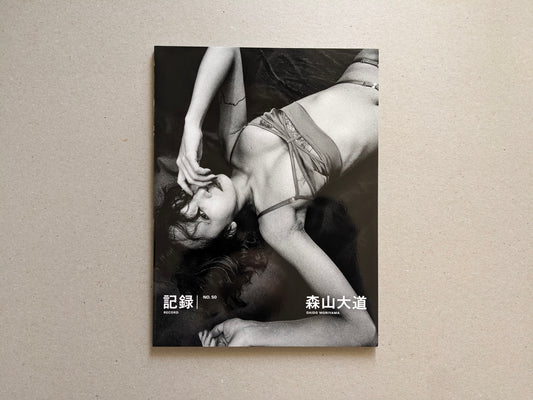 Front cover of Record No. 50 by Daido Moriyama, black-and-white photograph of a reclining woman.