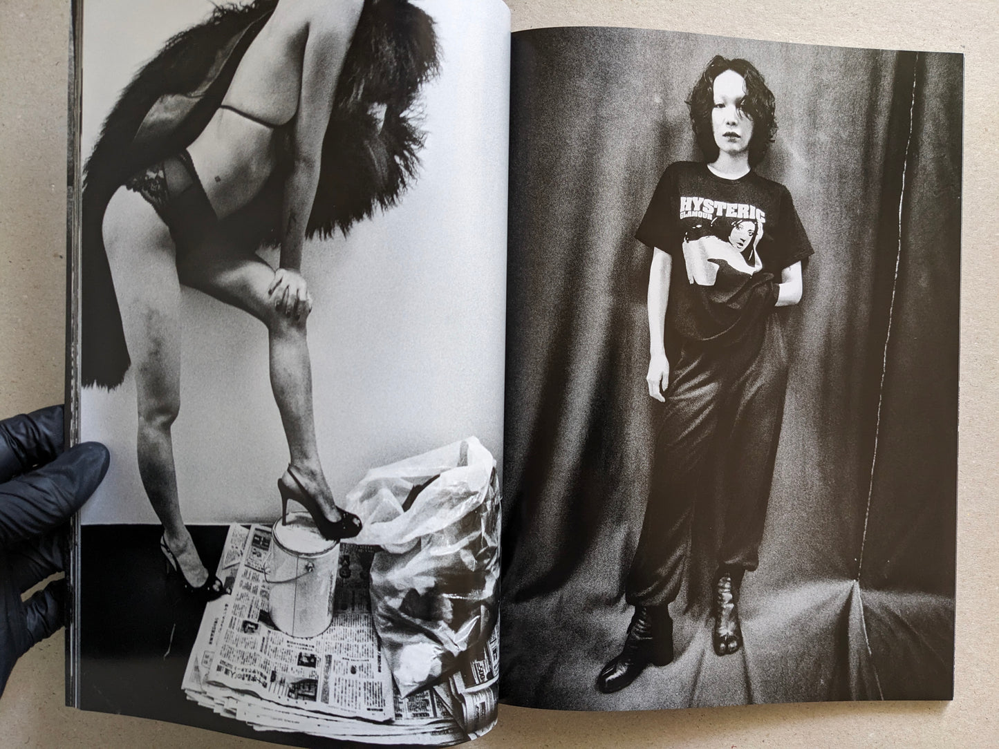 Spread of two studio portraits of women, Record No. 50 by Daido Moriyama.