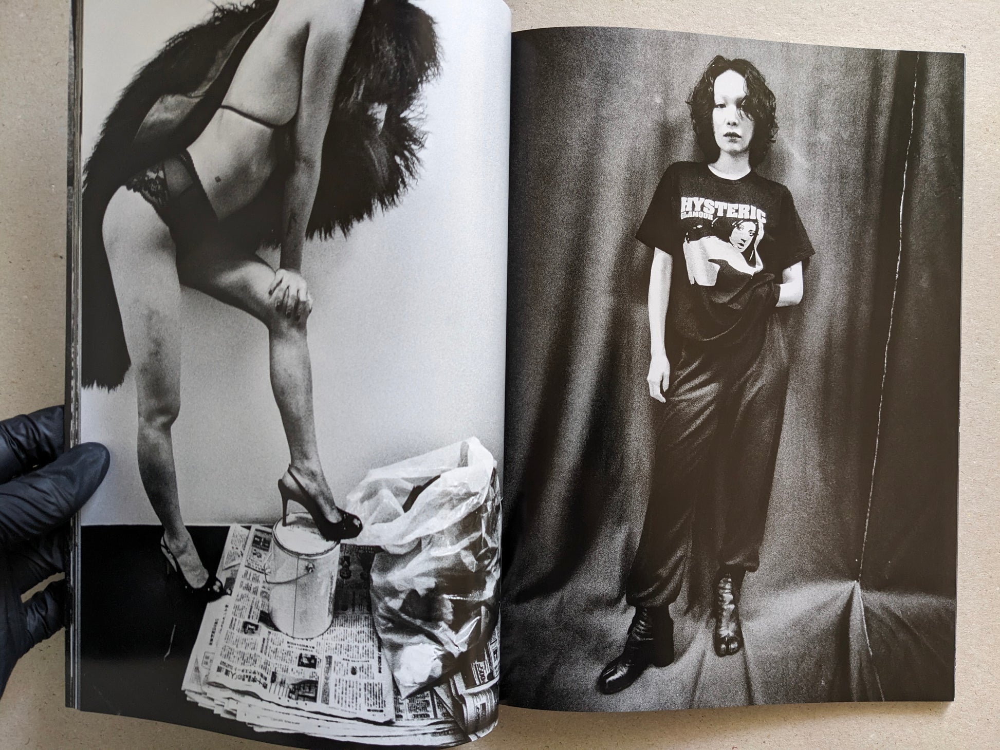 Spread of two studio portraits of women, Record No. 50 by Daido Moriyama.