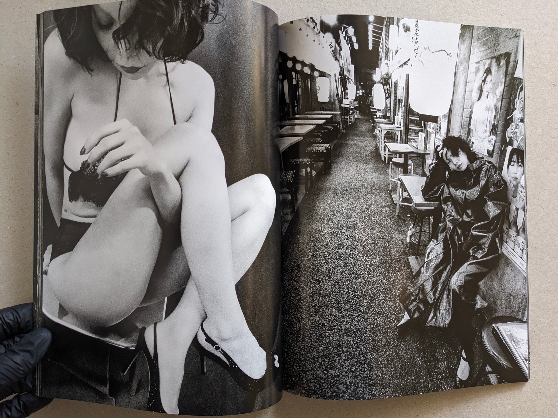 Spread pairing a seated studio portrait with a night street scene, Record No. 50 by Daido Moriyama.