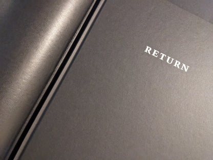 Close-up of the black cover with the title “RETURN” on Return by Larry Clark.