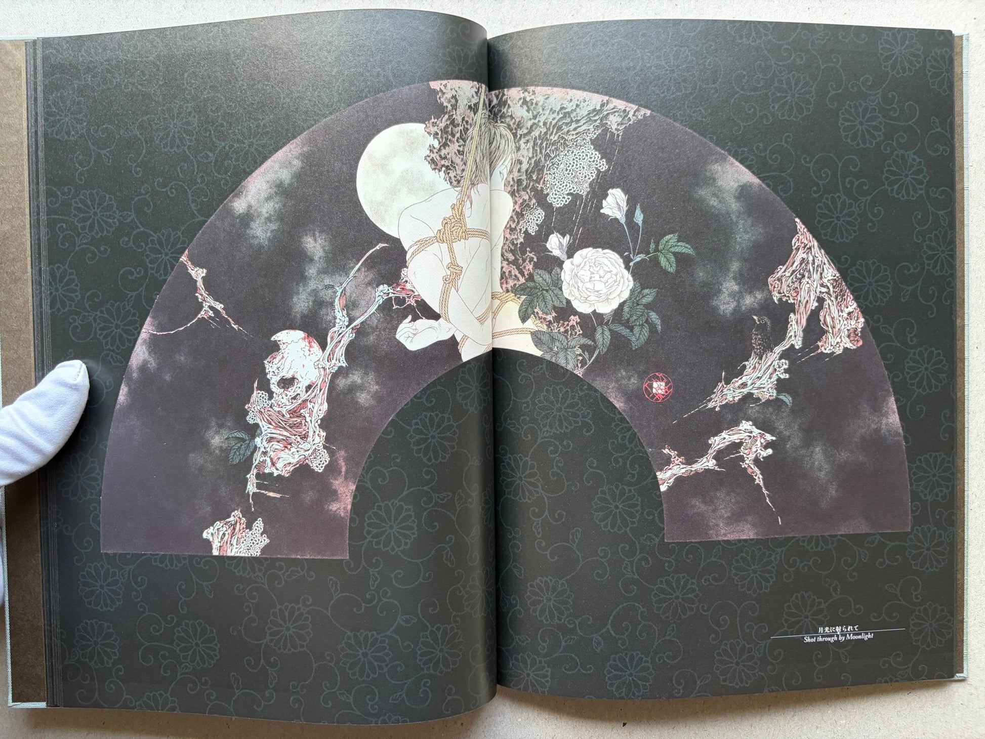 Rib of a Hermaphrodite by Takato Yamamoto, interior spread with a seated figure on the left and a reclining figure on the right.