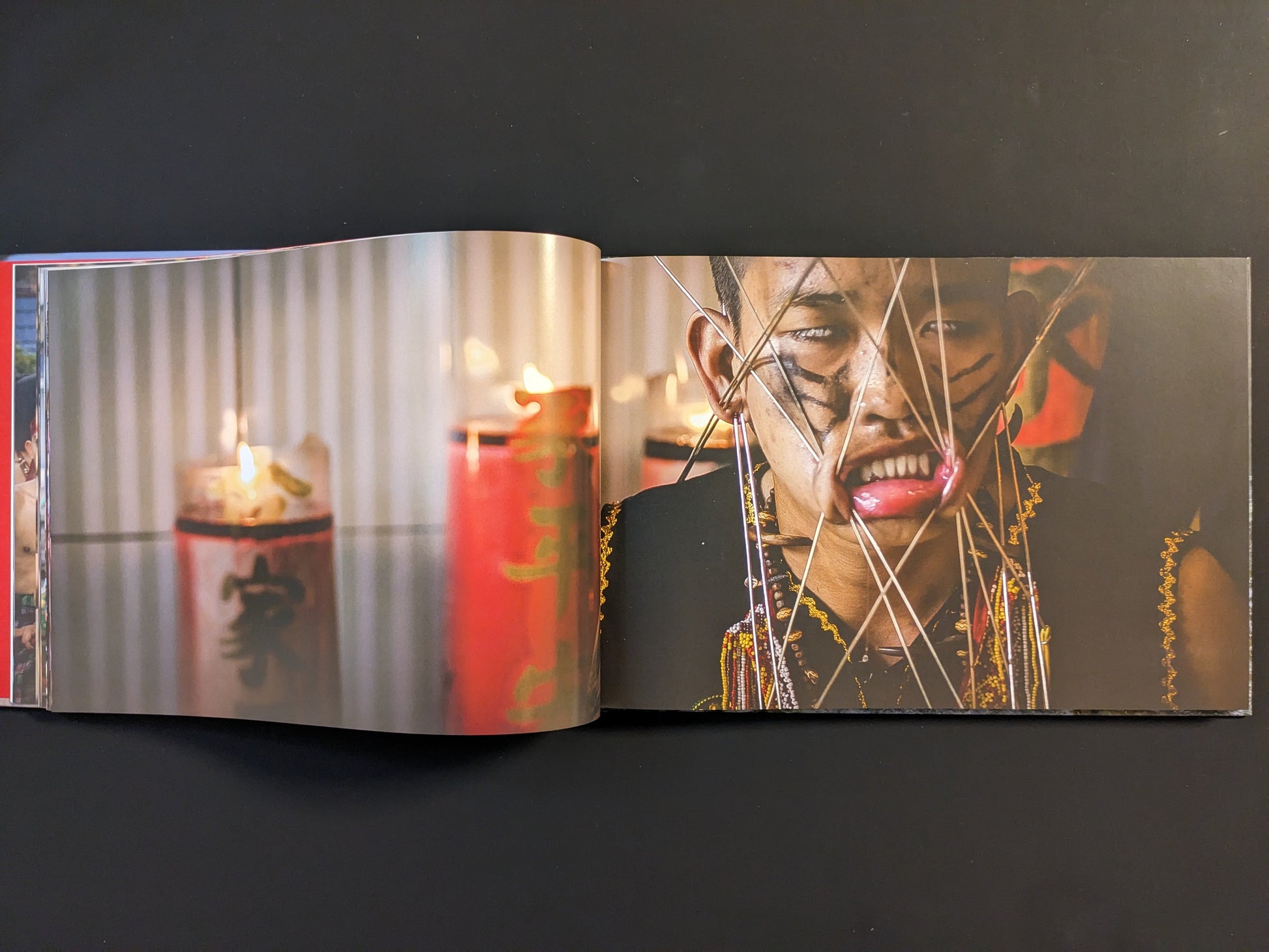 Participant with multiple facial piercings during a spiritual ceremony.