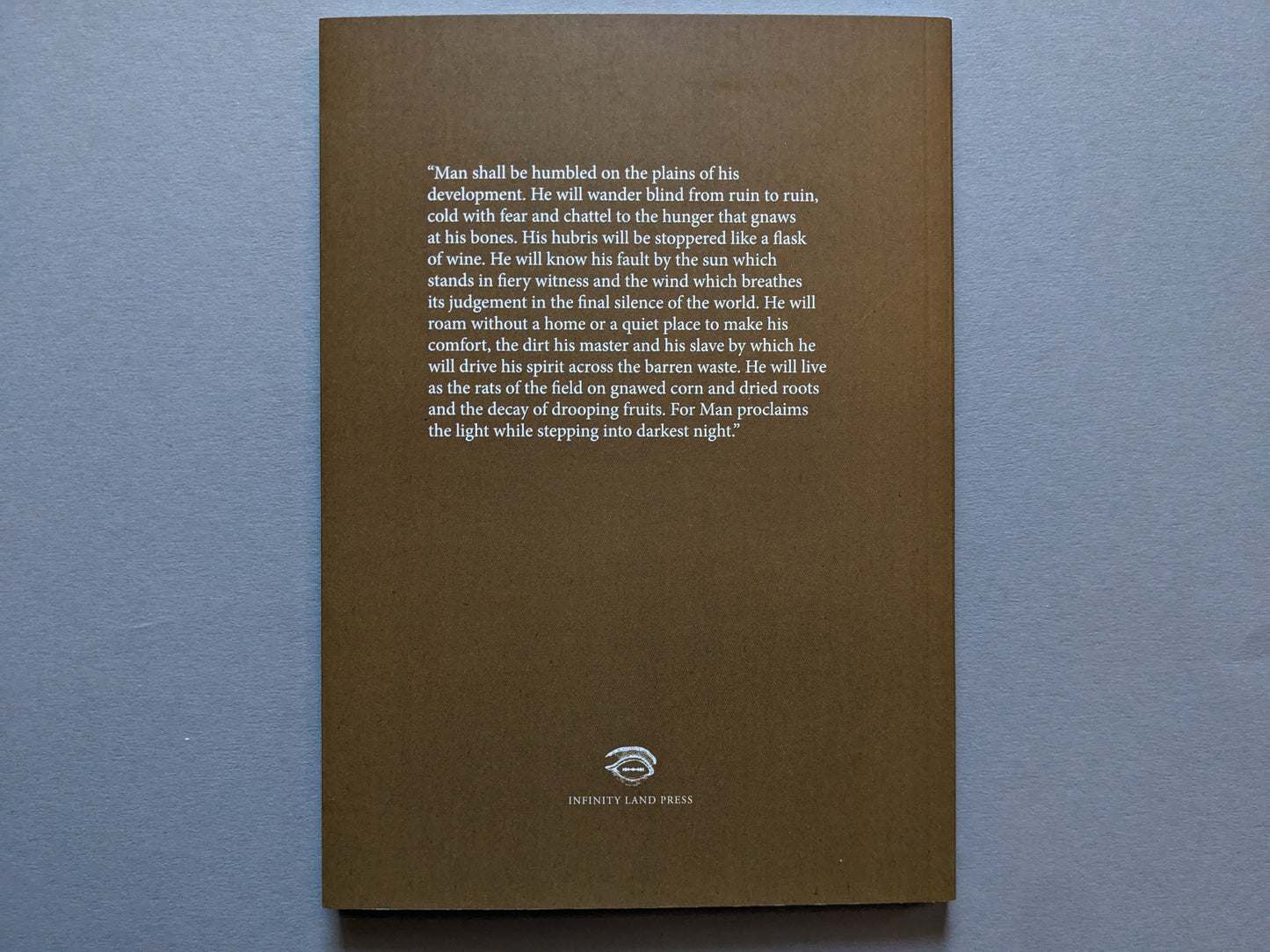 Back cover of Sacra with a prophetic passage in white text on a brown background