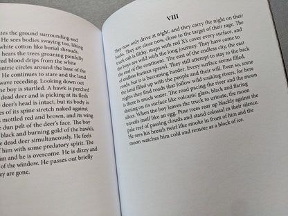 Pages from Sacra with poetic text about nocturnal travel across a dystopian landscape
