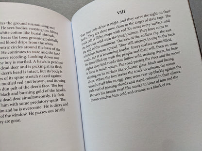 Pages from Sacra featuring a poetic description of nocturnal travel across a dystopian landscape.