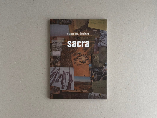Cover of Sacra by Sean M. Huber, shown on a neutral background.