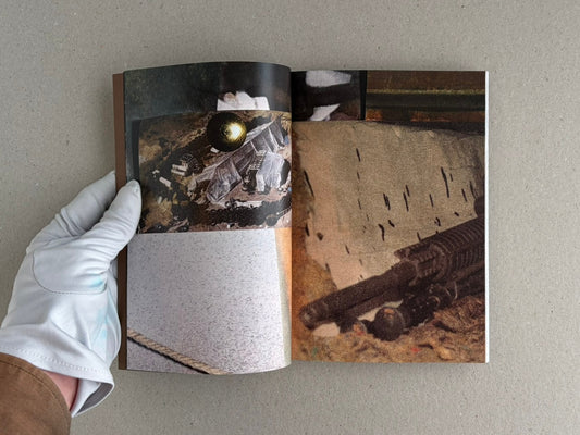 Open spread of Sacra by Sean M. Huber, showing collage-like interior pages with dark and earth-toned imagery.