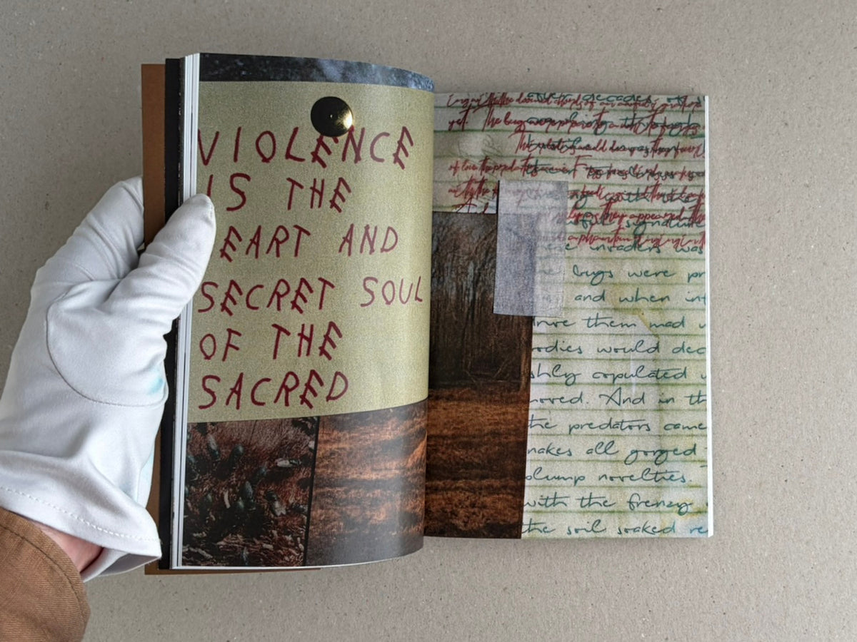 Open spread of Sacra by Sean M. Huber, showing handwritten text, layered collage pages, and a gloved hand holding the book open.