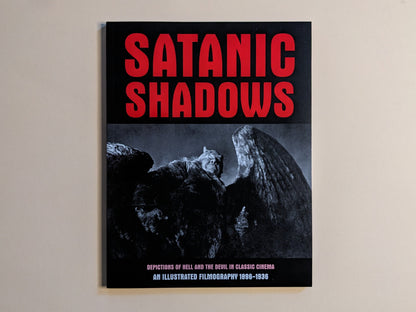 Front cover of 'Satanic Shadows', showing a red title and an image of a winged demon from early cinema.
