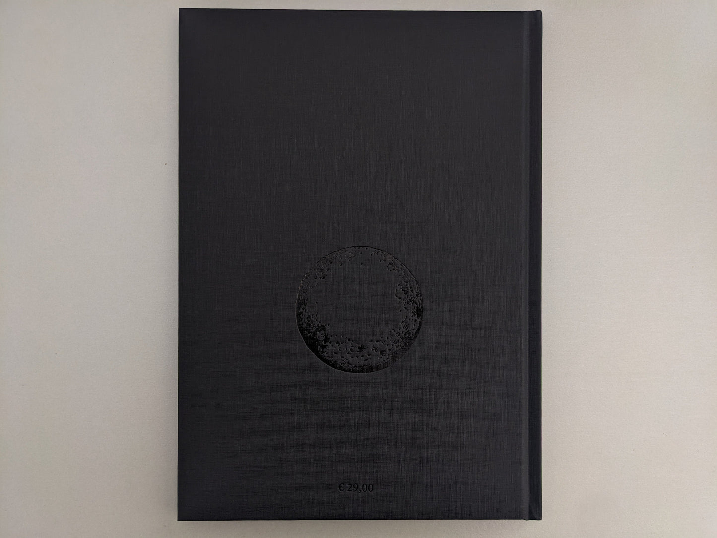 Back cover of Scions of Voodoo with black hot-foil design