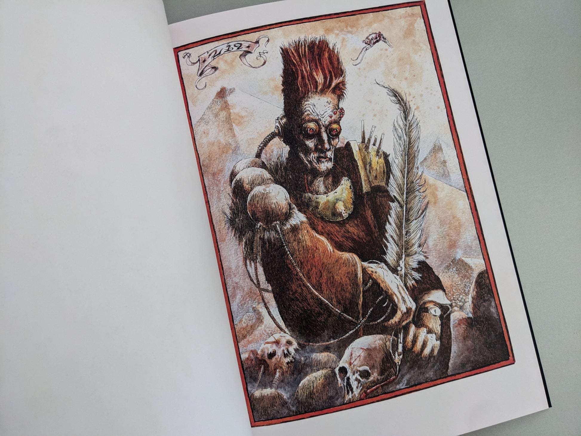 Dark fantasy figure with a quill and skulls