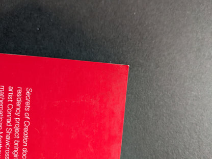 Visible corner dent on the top of back cover.