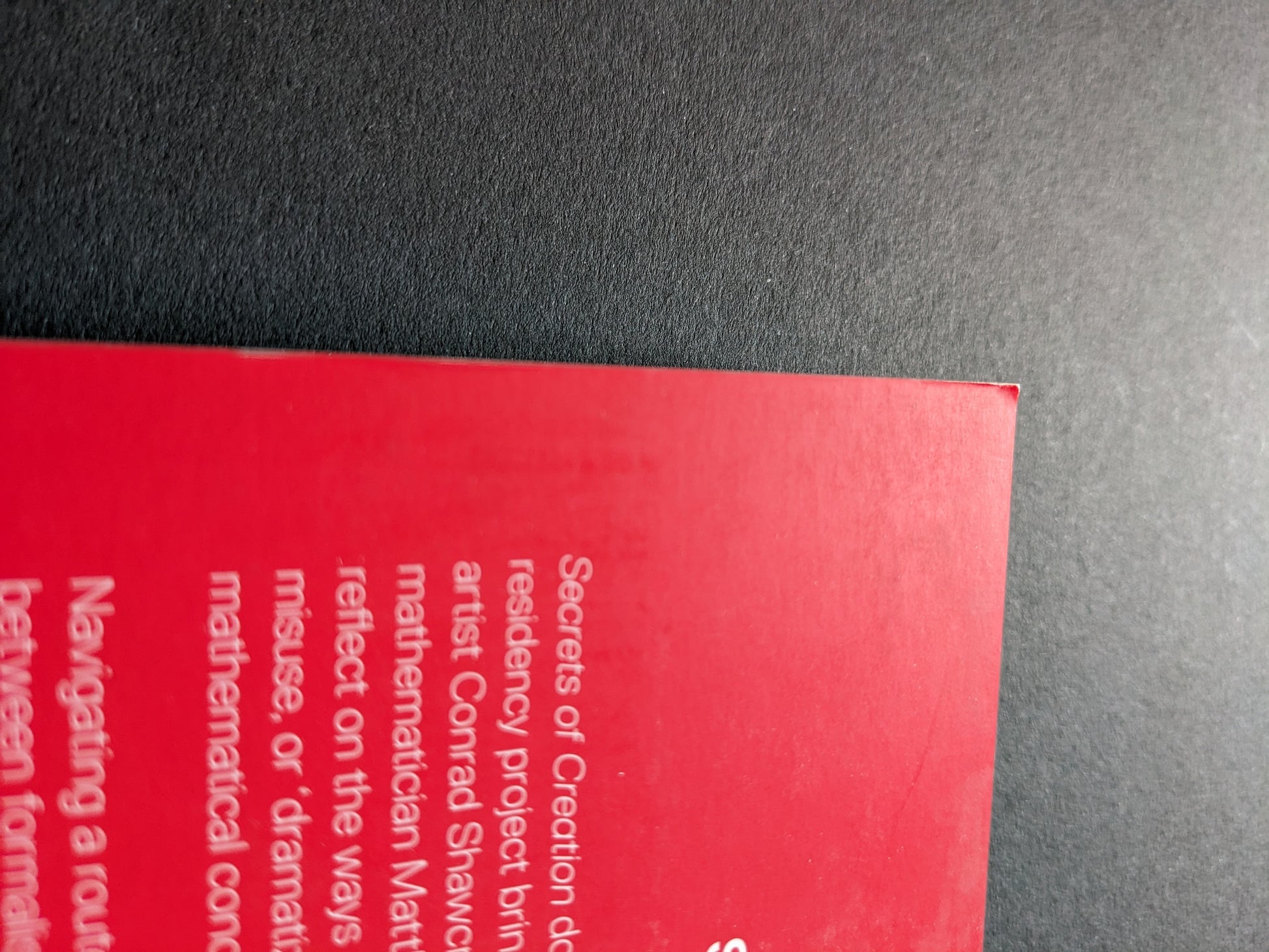 Slight fold at the top corner of the front cover.