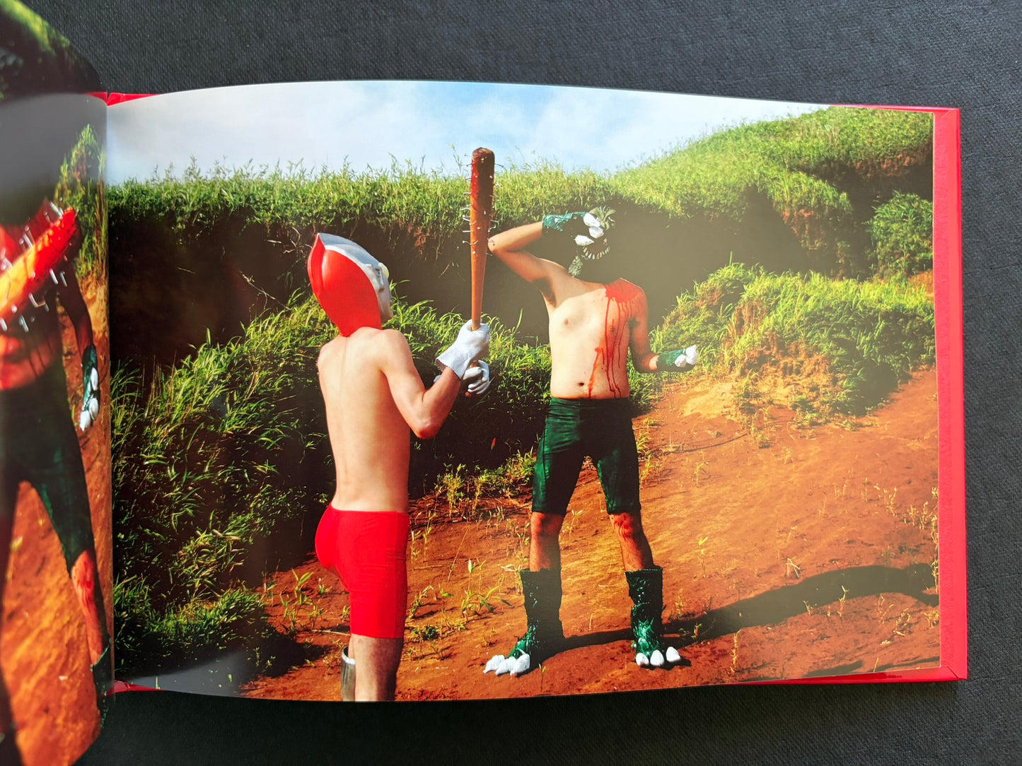 Open photobook spread from SEKAINOHEIWA by Daisuke Matsumoto