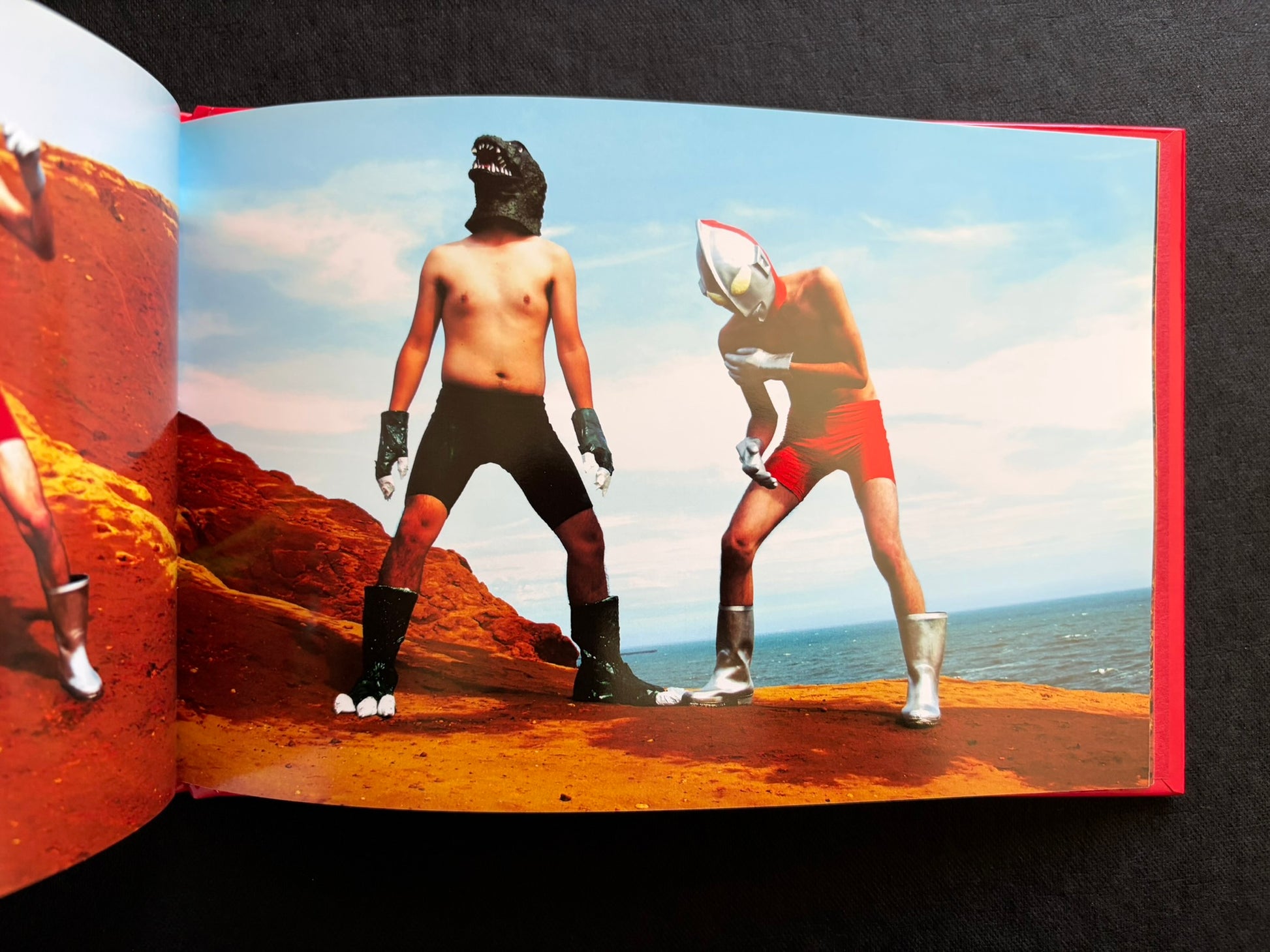 Open photobook spread from SEKAINOHEIWA by Daisuke Matsumoto