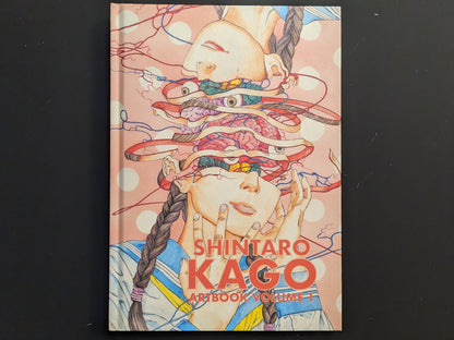 Front cover showing Kago’s exploded portrait illustration in pastel tones with red typography.
