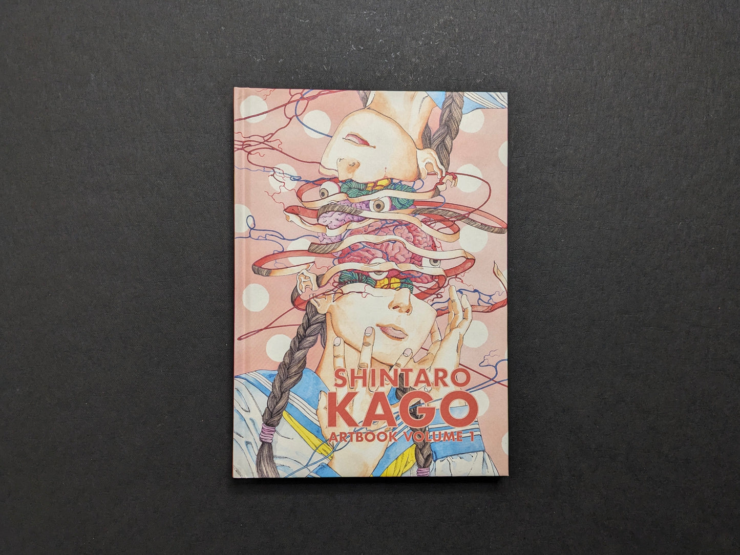 Front cover of Shintaro Kago: Artbook Vol. 1 (Third Edition) with an exploded portrait illustration and red title text.
