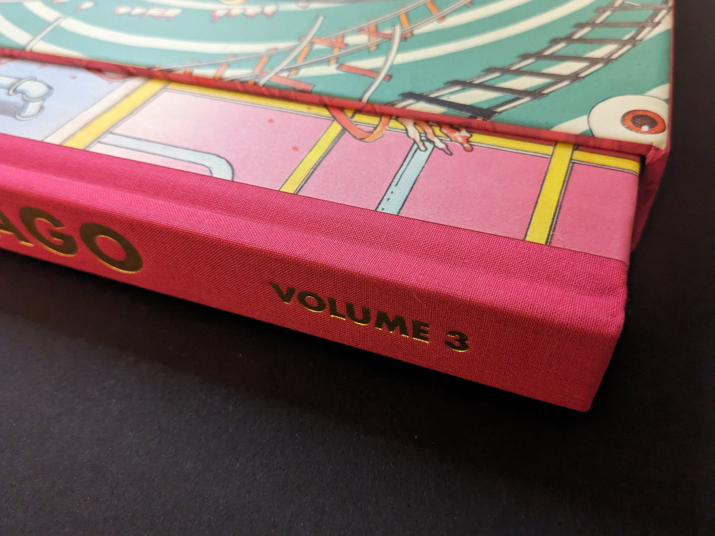 Cloth spine detail with gold Volume 3 title, Shintaro Kago Artbook Vol. 3 collector’s edition