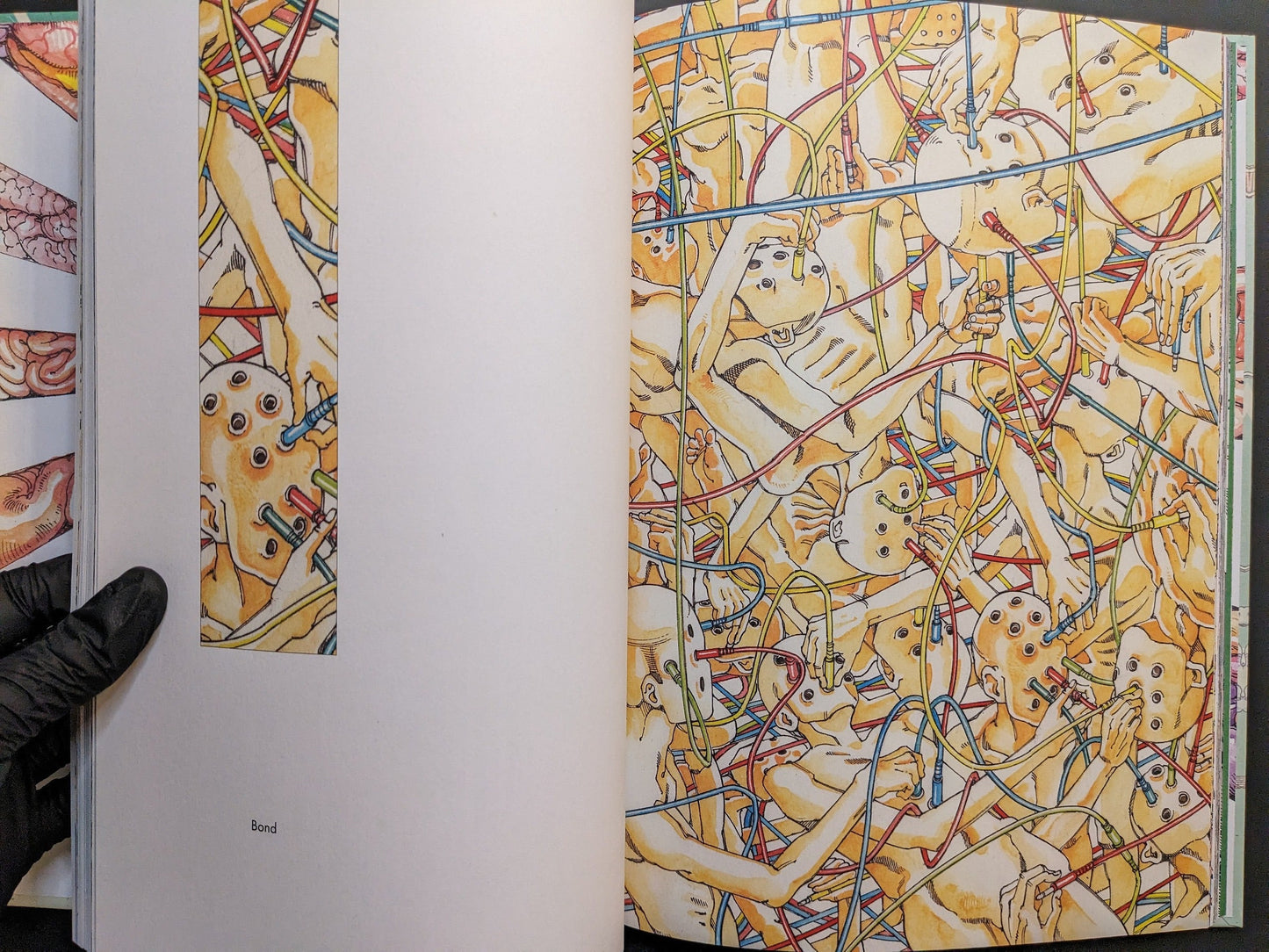 “Bond” spread with wired figures and multicolored tubes in an intricate network.