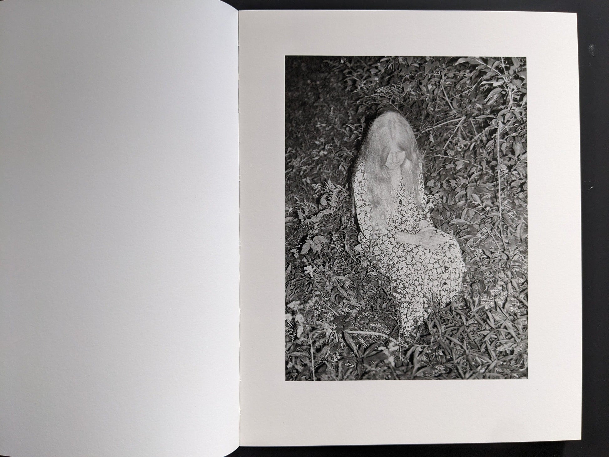 Interior spread: nocturnal scene with human form on forest floor from “Sleep Creek.”