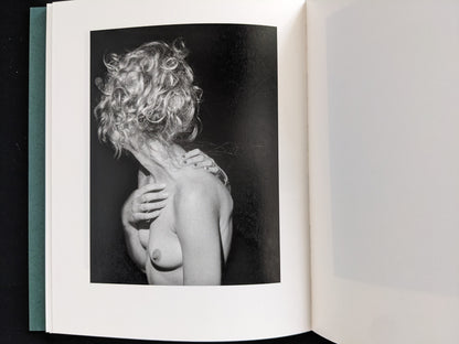 Black-and-white photograph of a woman with curly hair turning away, bare torso and hand on shoulder — from Sleep Creek by Dylan Hausthor & Pia Paulina Guilmoth (Void).