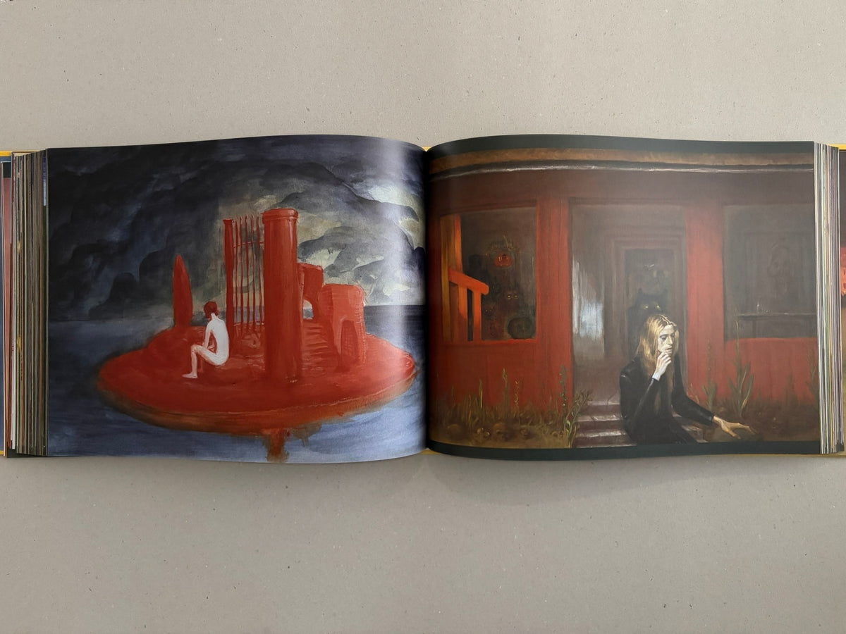 Open spread from SOLUTION issue 5 by Aleksandra Waliszewska, showing two full-page artworks with red architectural forms and a seated figure on the left, and a blonde figure in front of a red building on the right.