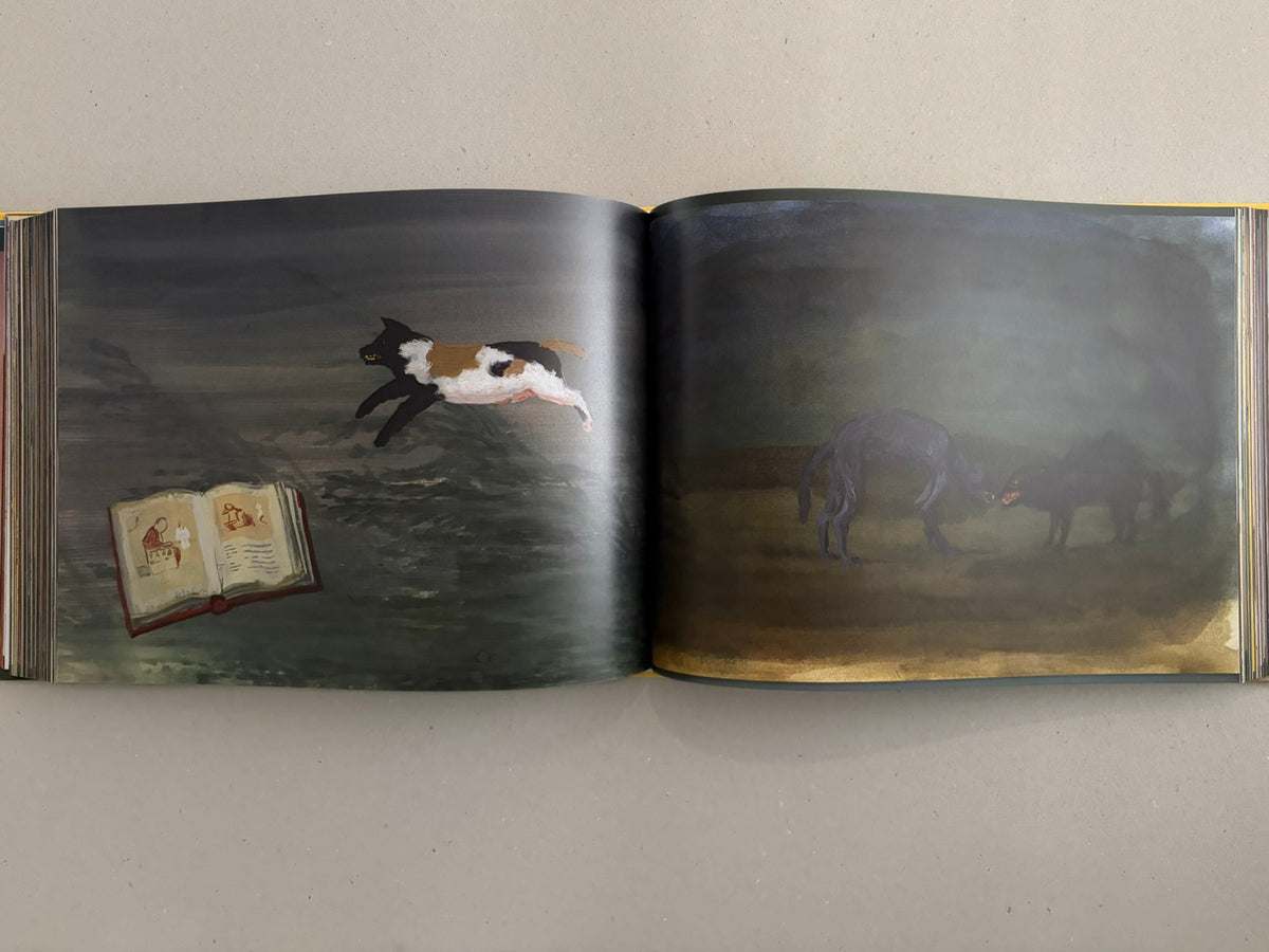 Open spread from SOLUTION issue 5 – Aleksandra Waliszewska, showing a dark painted scene with a leaping cat on the left page, an open illustrated book at lower left, and two animal figures in a dim landscape on the right page.