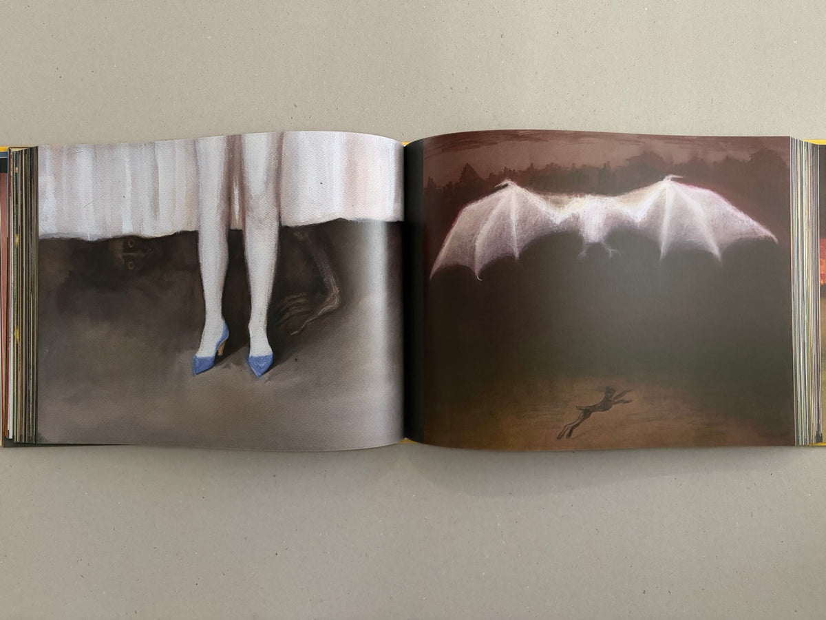 Open spread from SOLUTION issue 5 by Aleksandra Waliszewska, showing two full-bleed artworks with pale legs in blue heels on the left and a white winged figure on the right.