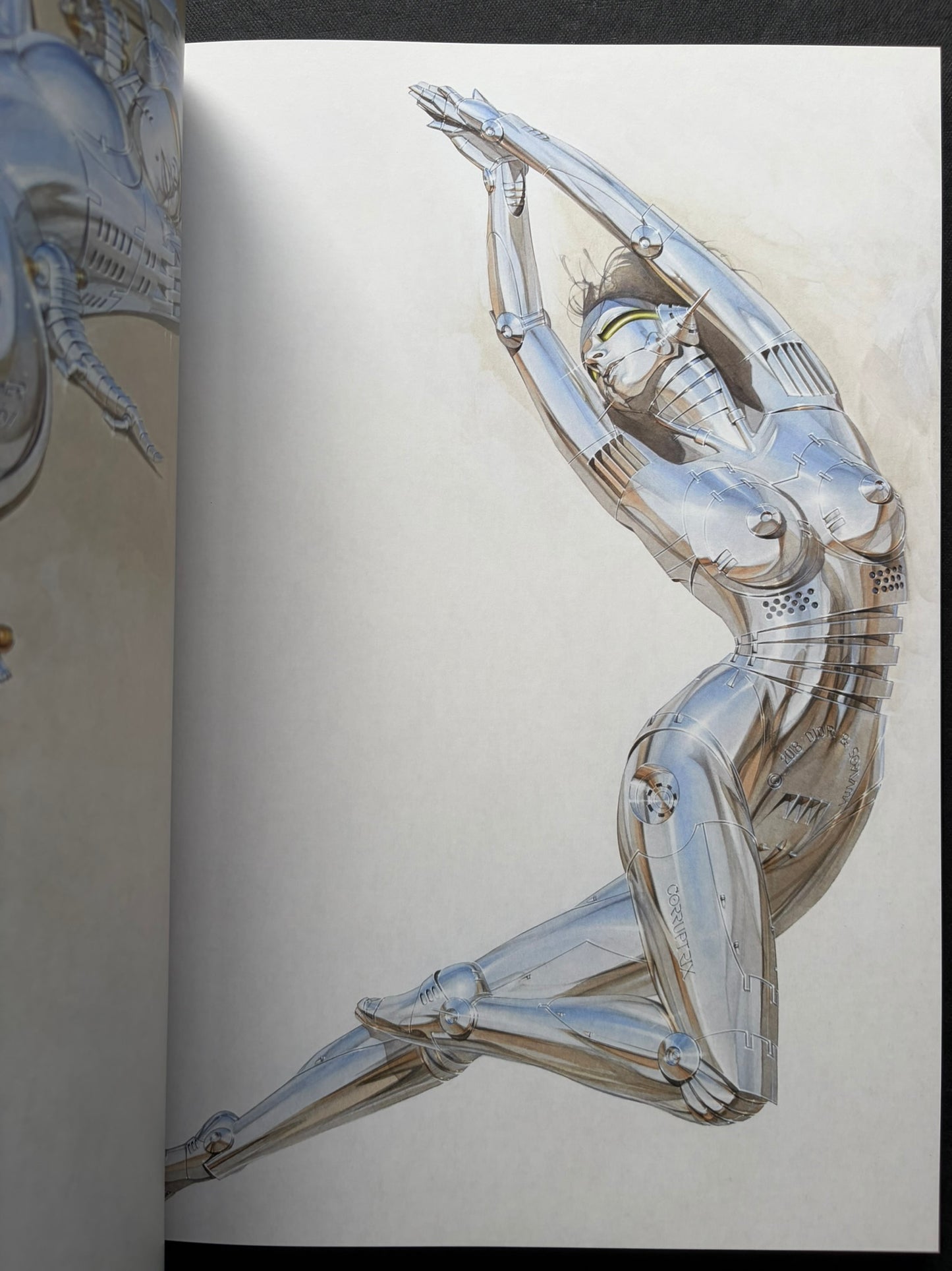 Interior spread of a seated chrome gynoid figure in SORAYAMA: THE GYNOIDS SUBLIME.