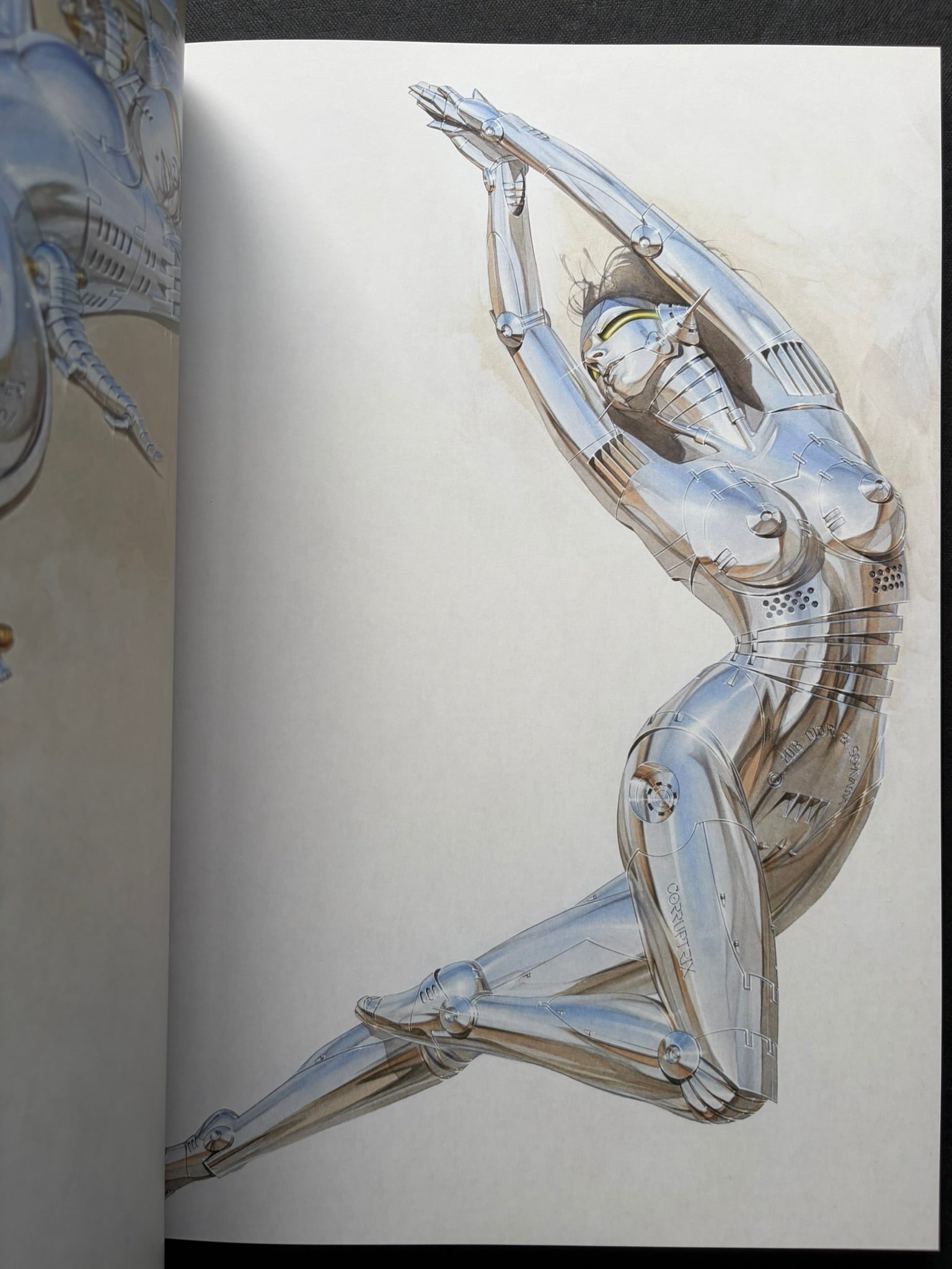 Interior spread of a seated chrome gynoid figure in SORAYAMA: THE GYNOIDS SUBLIME.