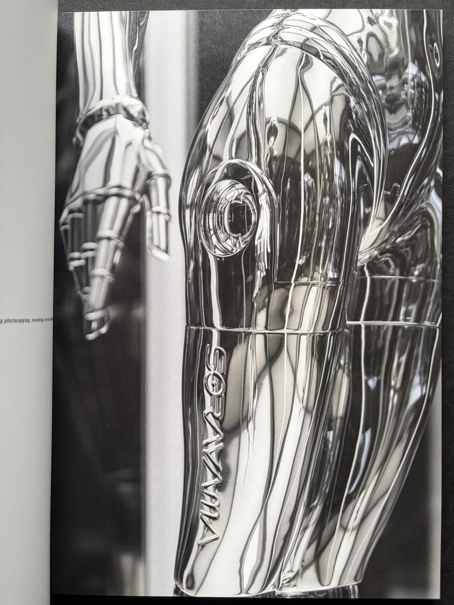 Interior spread of a chrome-toned robotic figure in SORAYAMA: THE GYNOIDS SUBLIME.