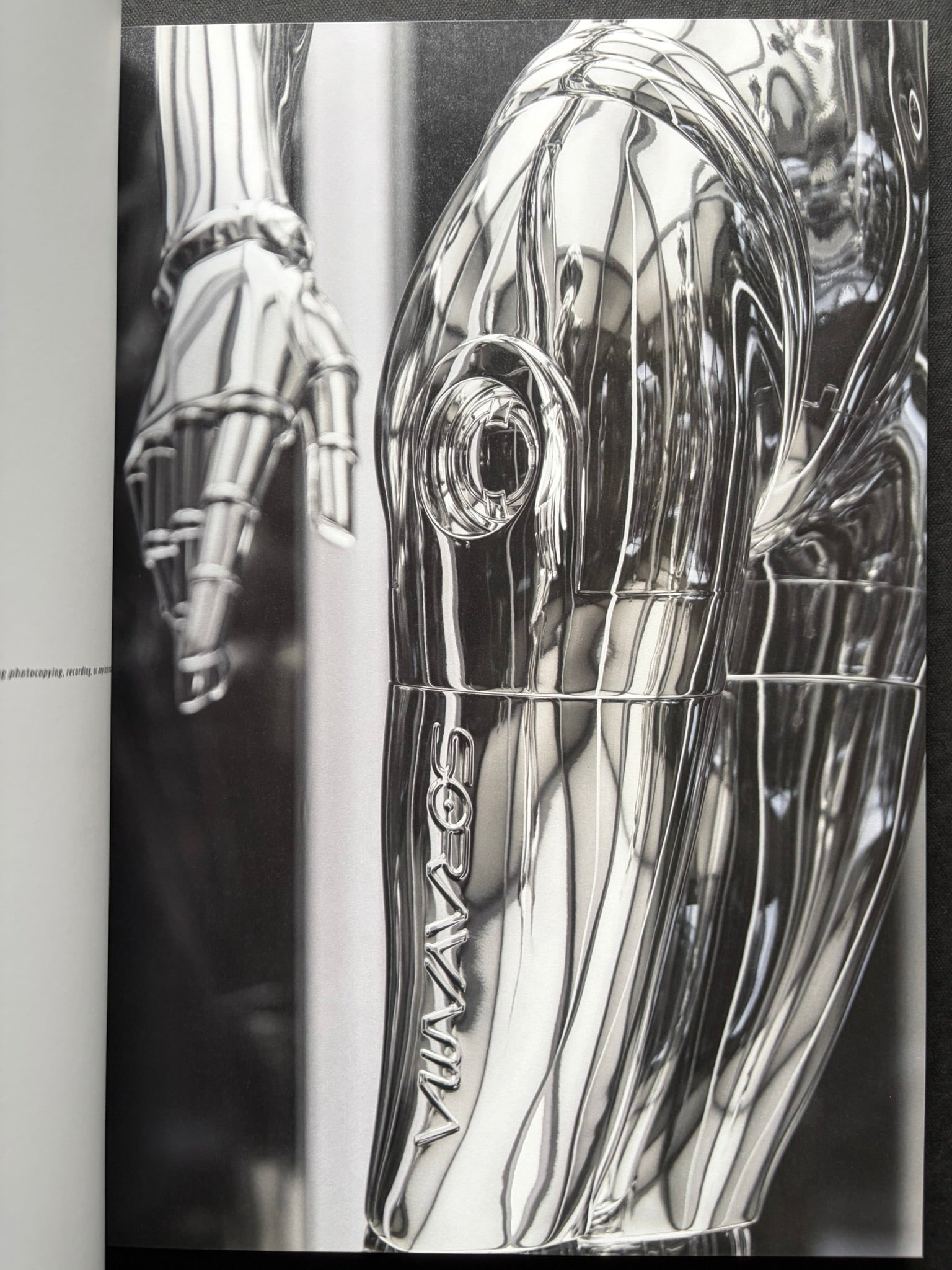 Interior spread of a chrome-toned robotic figure in SORAYAMA: THE GYNOIDS SUBLIME.
