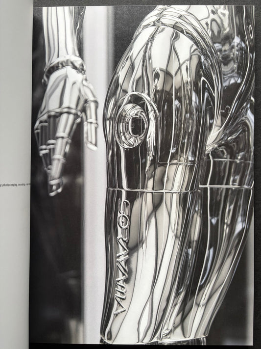 Interior spread of a chrome-toned robotic figure in SORAYAMA: THE GYNOIDS SUBLIME.