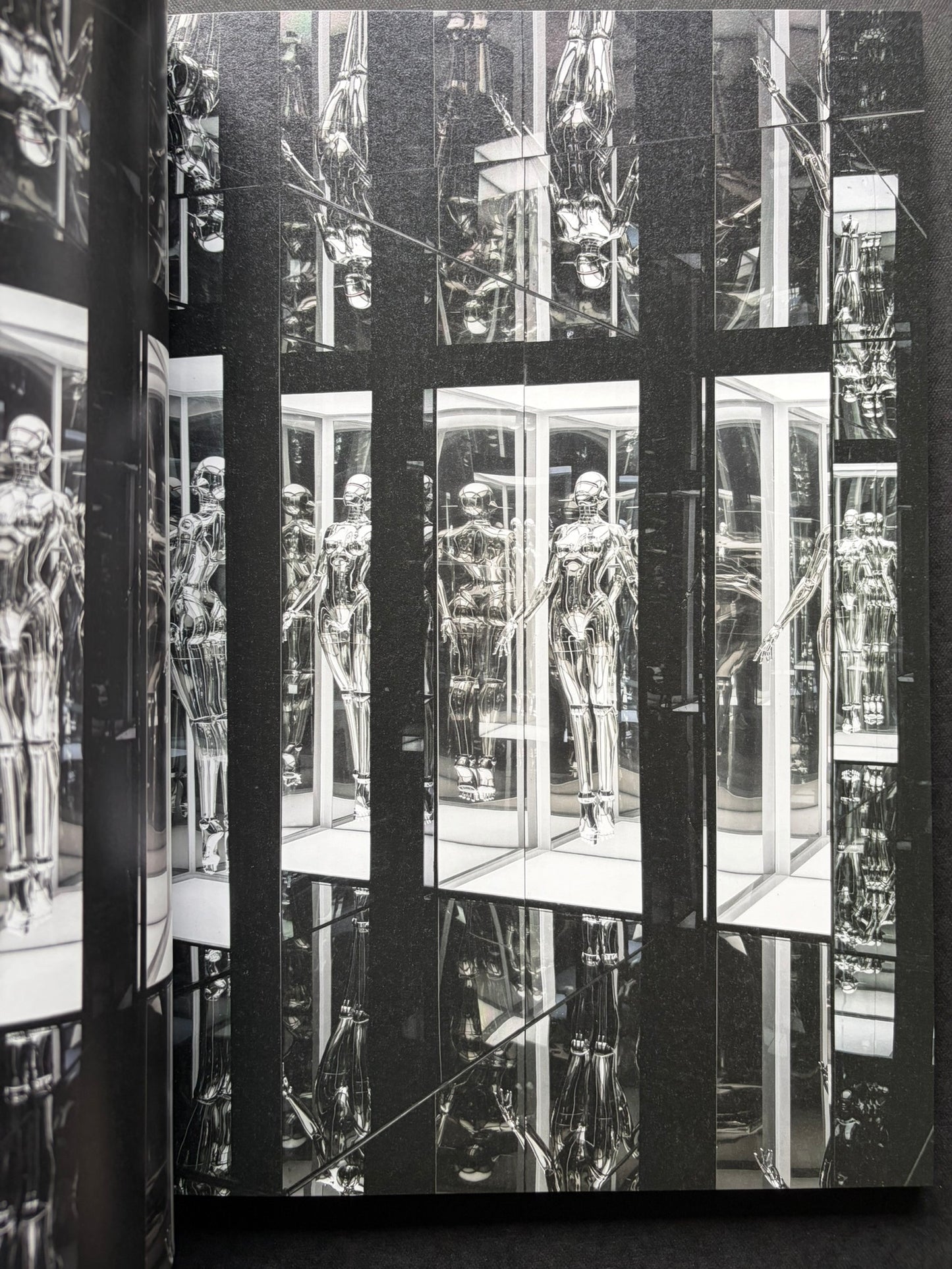 Interior spread of mirrored chrome gynoid figures in a display-like installation in SORAYAMA: THE GYNOIDS SUBLIME.