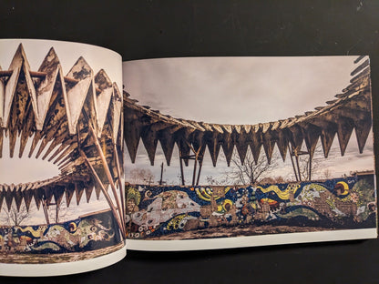Interior spread: dramatic sawtooth concrete canopy with colorful mosaic frieze of waves and stars.