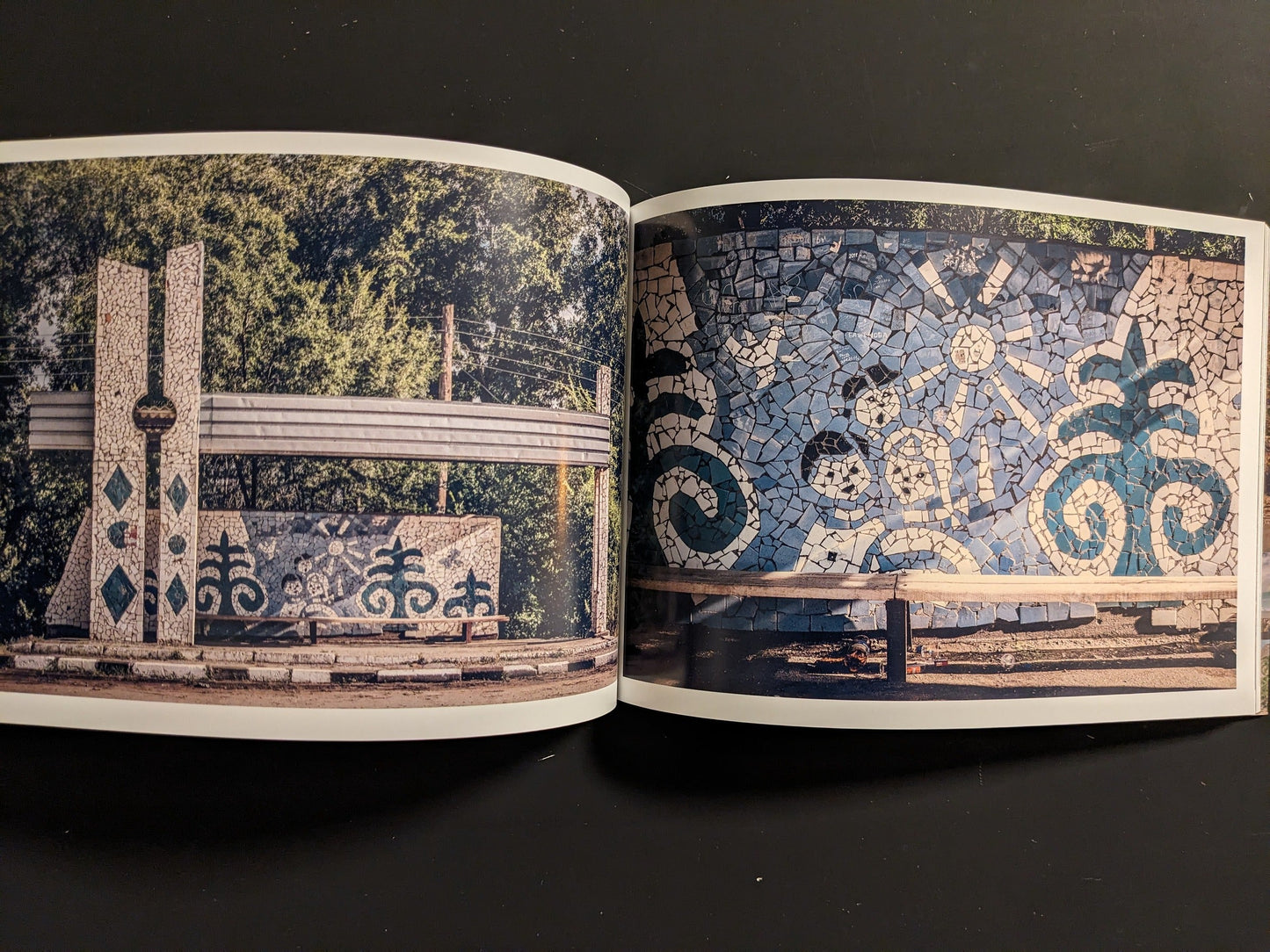 Interior spread: close view of blue tile mosaic patterns; opposite page shows a mosaic sign and shelter facade.