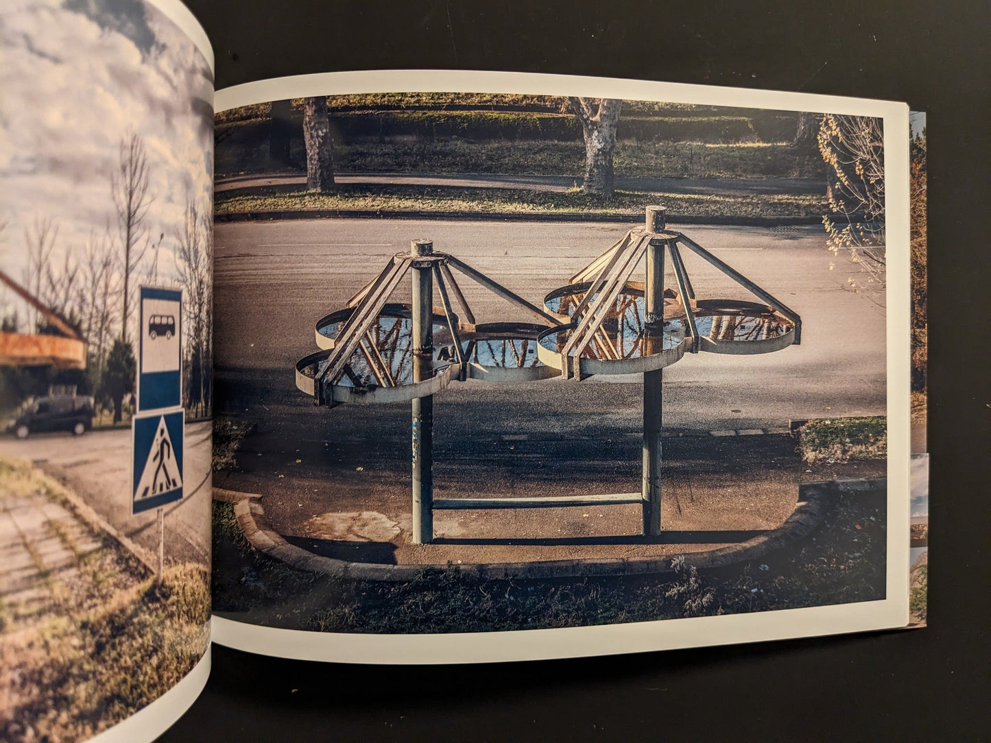 Interior spread: sculptural, flower-like bus stop canopy seen from above; adjacent page with bus stop sign.