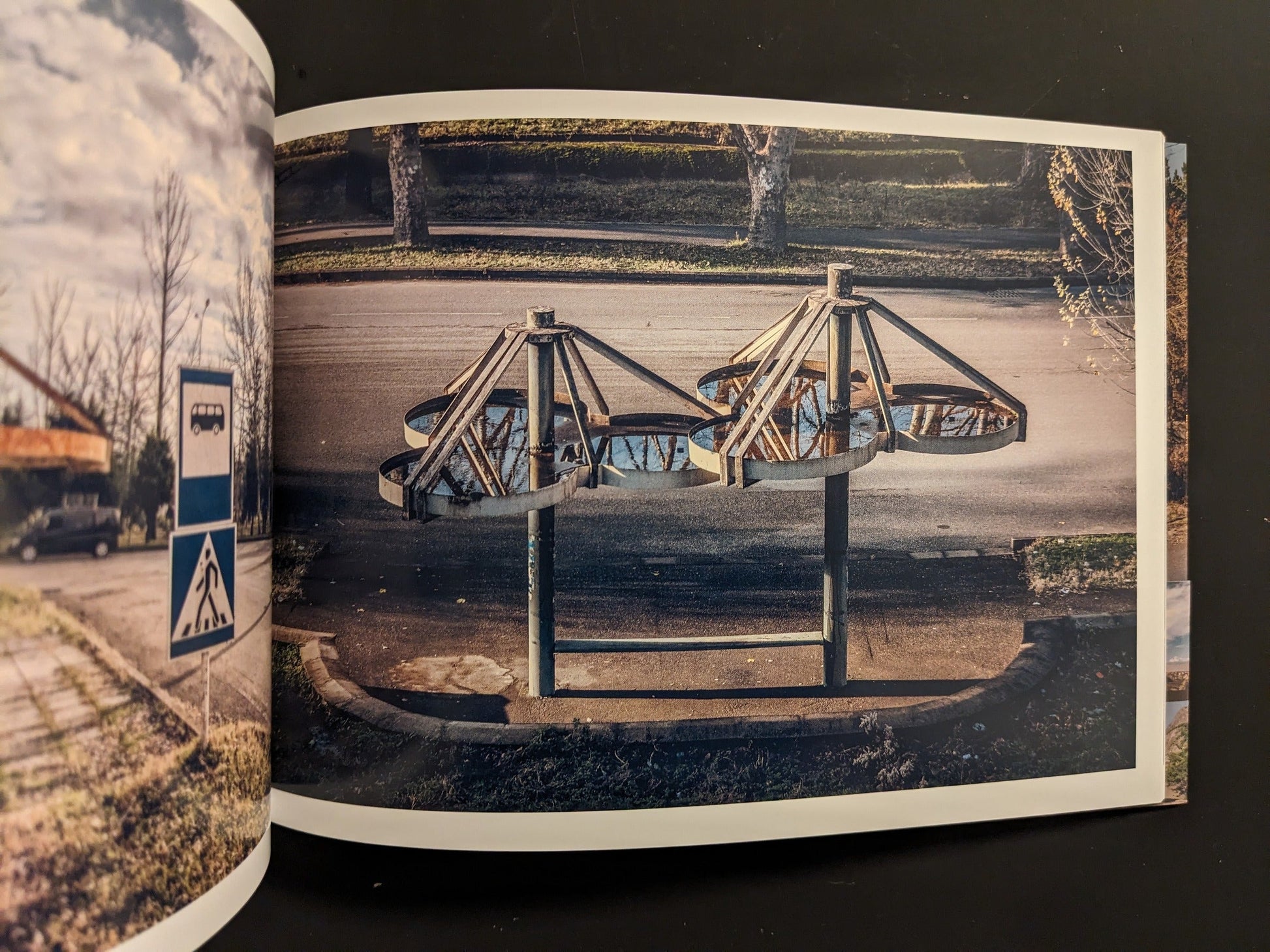 Interior spread: sculptural, flower-like bus stop canopy seen from above; adjacent page with bus stop sign.