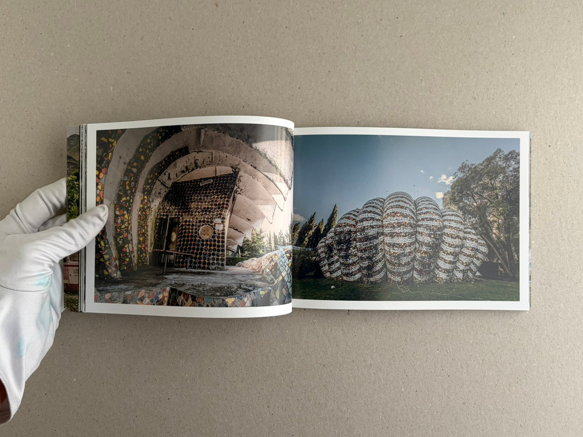 Open spread from Soviet Architectural Design by Hoshino Ai, with a mosaic-lined interior on the left and a rounded, mosaic-covered structure on the right.