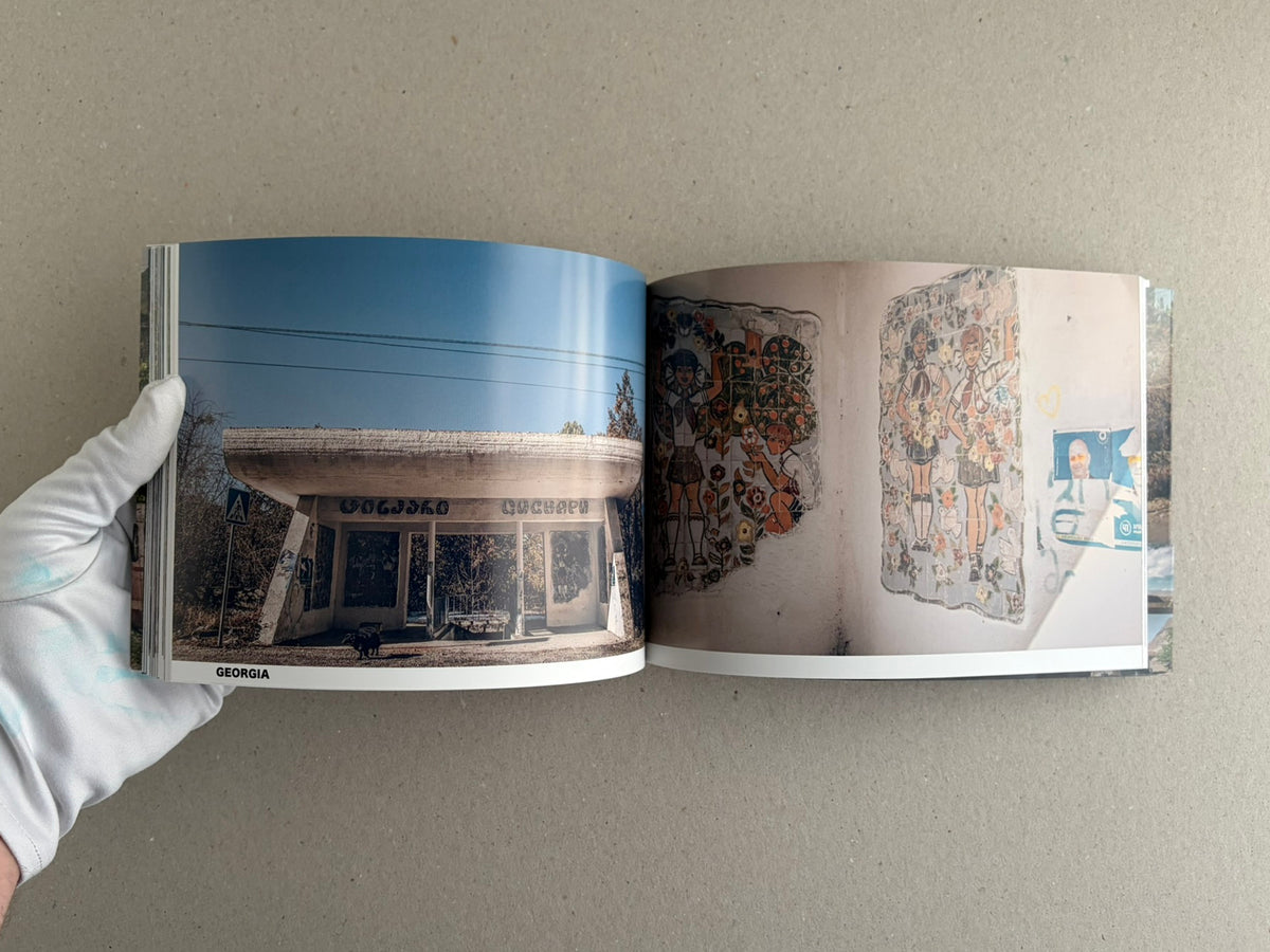 Open spread from Soviet Architectural Design by Hoshino Ai, showing a roadside shelter with painted figures on the left and a brick mural on the right.