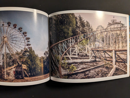Interior spread: overgrown roller coaster and ferris wheel in a deserted amusement park.