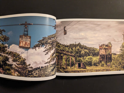 Interior spread: weathered cable-car tower with a rusted gondola suspended over trees.