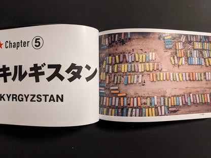 Spread opening “Kyrgyzstan” chapter with aerial rows of colorful buses at a depot.
