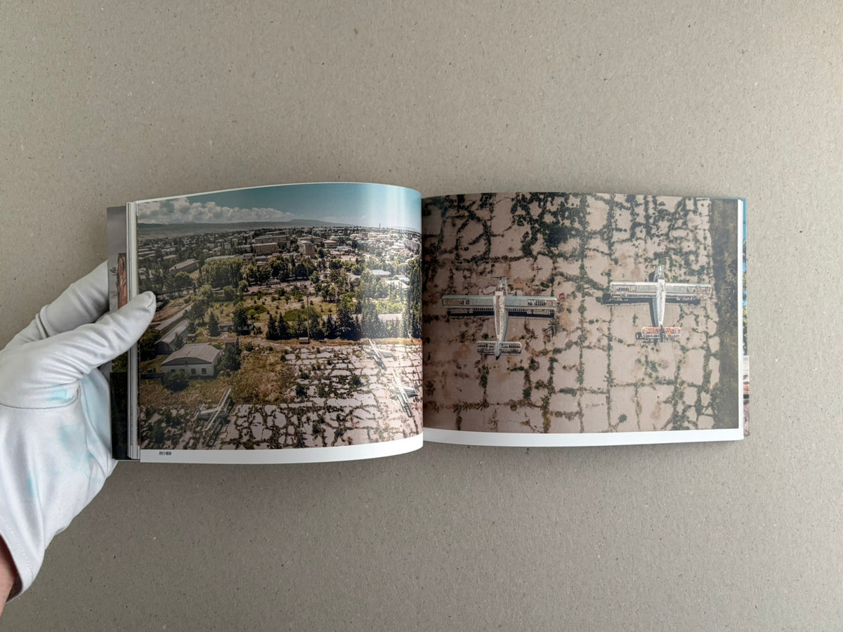 Soviet Transport open spread with an aerial city view and rows of abandoned train cars
